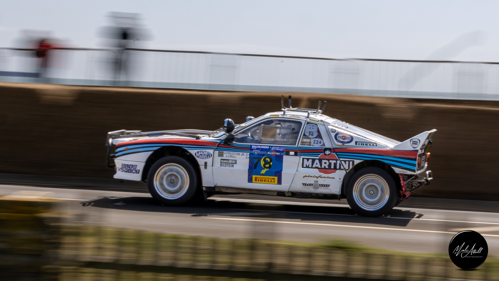 Martini-liveried Lancia 037 Group B rally car at full speed