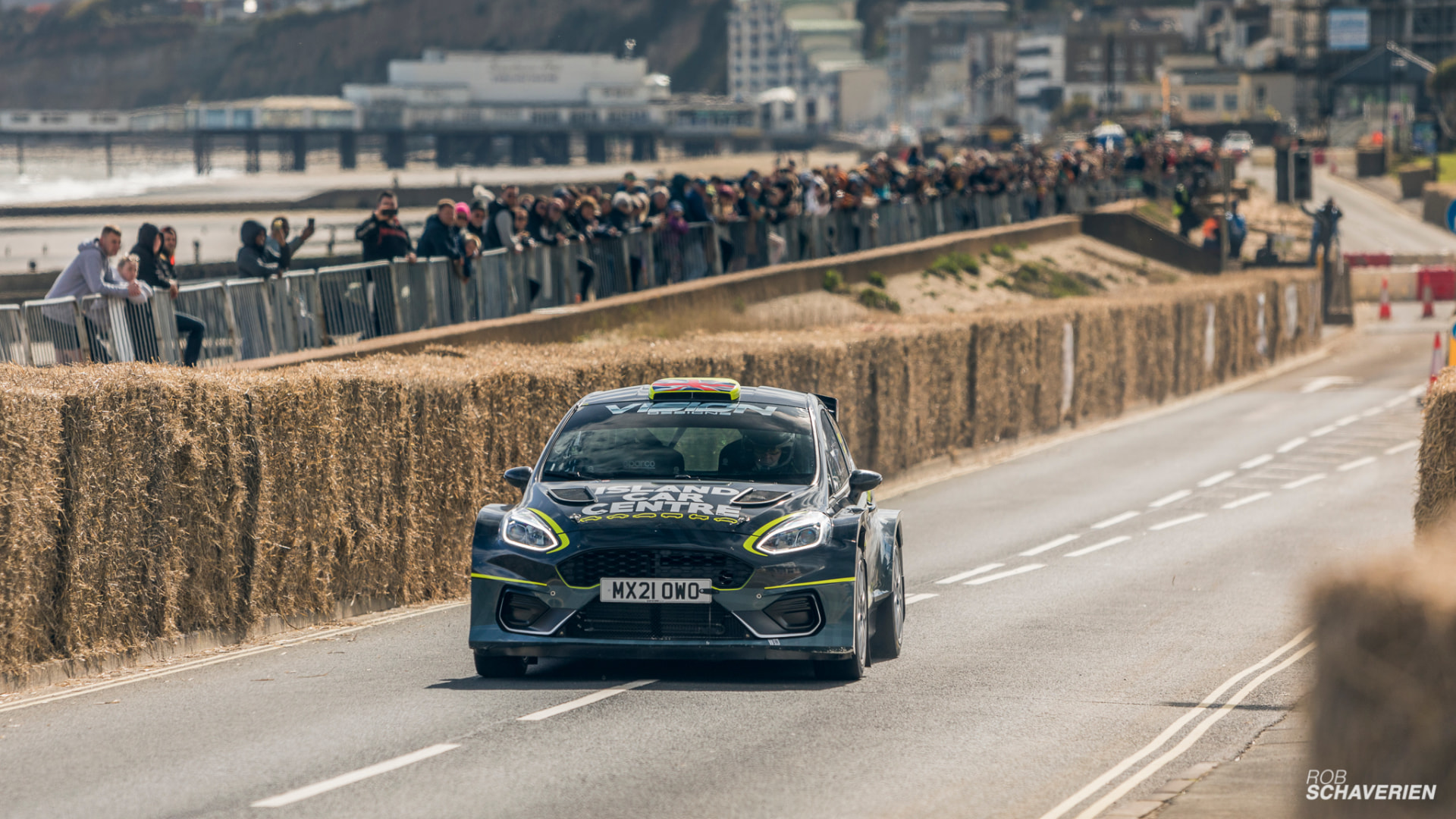 Rally car at speed on the closed-road seafront course at the Isle of Wight Sprint